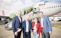  ?? JOHN NGUYEN/PA/VIRGIN ?? Richard Branson celebrates the use of environmen­tally friendly fuel for a Virgin flight from Orlando to England in October.