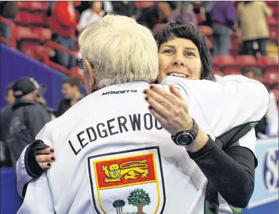  ?? RACHELE LABRECQUE/SAULT STAR ?? Kathy O’Rourke and coach Al Ledgerwood celebrate after Team P.E.I. won its semifinal game and advanced to the final of the 2010 Scotties Tournament of Hearts Canadian women’s curling championsh­ip in Sault Ste. Marie, Ont.