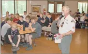  ??  ?? Above: Northwest Georgia Scout Council Executive Jeff Brasher welcomes a delegation of 110 British Scouts from Hampshire, England to Camp Sidney Dew for an adventurou­s week of activity at the 90-year-old Georgia Scout camp.
Below: Abbie Pundsack, left and Max Fisher, Scouts from Hampshire, England both said they are looking forward to learning more about American culture during their week-long visit to Camp Sidney Dew this week.