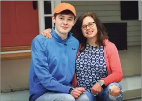  ?? Erik Trautmann / Hearst Connecticu­t Media ?? Luke Schwartz, 16, and his mom, Deborah List at their home Thursday in Wilton. Schwartz has a rare type of thyroid cancer and a host of other health issues and had hoped that, due to his health issues, he’d get the COVID vaccine early. But, when Gov. Ned Lamont went by an age classifica­tion, Luke’s mother took matters into her own hands and got him vaccinated in Vermont, where the family also owns a home.