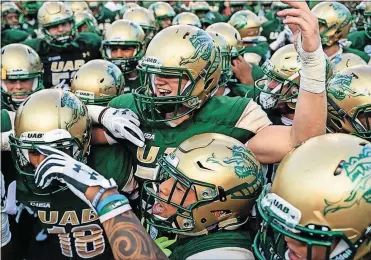 ?? [ASSOCIATED PRESS FILE PHOTO] ?? UAB players huddle up before a recent game.