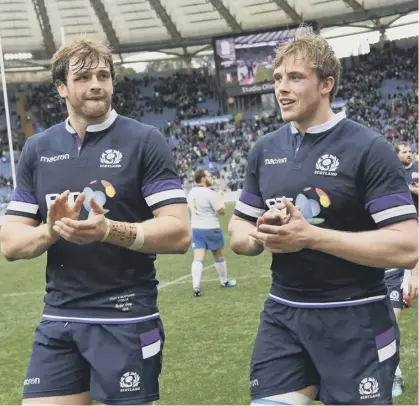  ??  ?? Scotland’s second-row brothers Richie and Jonny Gray after the Six Nations win over Italy in 2018