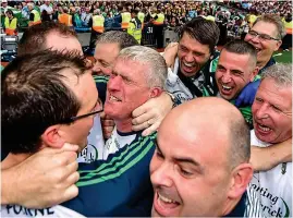  ?? SPORTSFILE ?? Mobbed: John Kiely (centre) celebrates with his backroom staff following Sunday’s win over Galway