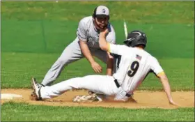  ?? BARRY TAGLIEBER — FOR DIGITAL FIRST MEDIA ?? Phoenixvil­le’s Luke LeBeau, back, tags out Pope John Paul II’s Sean Sutterby (9) on a steal attempt during the first inning Thursday.