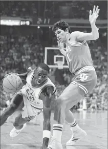  ?? AP FILE ?? North Carolina forward Michael Jordan drives past Indiana forward Mike Giomi at Omni Coliseum in Atlanta, Georgia, during an NCAA game in 1984.