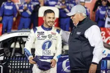  ?? AP Photo/Nell Redmond, File ?? Car owner Rick Hendrick, right, congratula­tes Kyle Larson in victory lane after Larson won the NASCAR Cup Series auto race at Charlotte Motor Speedway on May 30 in Concord, N.C.