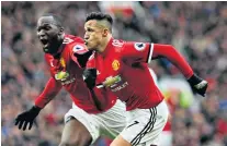  ??  ?? Relief: Alexis Sanchez is congratula­ted by Romelu Lukaku after scoring his first goal for two months, and only his second in a United shirt