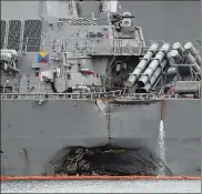  ?? WONG MAYE-E / ASSOCIATED PRESS ?? The port aft hull of the USS John S. McCain was damaged Aug. 21 after it collided with an oil tanker near Singapore. Ten sailors died in the incident. On Wednesday, the U.S. Navy relieved the commander and executive officer of the destroyer of their...