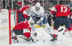  ?? JOEL AUERBACH / GETTY IMAGES ?? Goaltender Roberto Luongo stops a shot by James van Riemsdyk in second-period action at the BB&T Center.