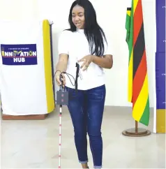  ?? UZ ?? Tafadzwa Muusha, a student demonstrat­es how the Smart Blind Stick works at the institutio­n’s Innovation Hub