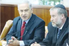  ?? (Marc Israel Sellem/The Jerusalem Post) ?? ATTORNEY-GENERAL Avichai Mandelblit listens as Prime Minister Benjamin Netanyahu speaks at a government meeting in 2015.