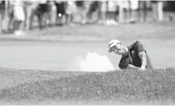  ?? BRYNN ANDERSON/AP ?? Adam Scott hits to the seventh green during the third round of the PGA Championsh­ip. He is two strokes behind Brooks Koepka for the lead.