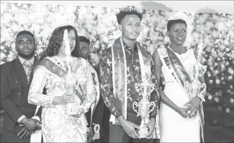  ?? ?? Reshma Seemangal (left) and Anthonio Johnson (centre) after winning the Miss and Mr Deaf Guyana pageant in 2022