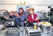  ??  ?? Visit Alyn Smith and Nicola Sturgeon pose for a selfie with Bisma Naz, a member of staff at Perthshire Preserves during a visit last Wednesday by the SNP candidate and First Minister to the company’s premises at Stirling Enterprise Park