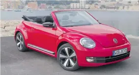  ?? ZACK SPENCER/ POSTMEDIA NEWS ?? The 2013 Beetle Convertibl­e has a cropped roof, edgier styling and great-looking wheels.