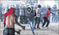  ?? ERALDO PERES / ASSOCIATED PRESS ?? Demonstrat­ors clash with police during a protest in Brasilia, Brazil, on Wednesday.