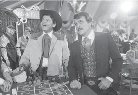  ?? Wally Fong / Associated Press 1980 ?? Actors Ross Martin (left) and Robert Conrad are shown while filming a scene of the motion picture “More Wild, Wild West” in Los Angeles in 1980.