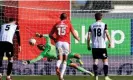  ?? Photograph: Simon Stacpoole/Offside/Getty Images ?? Ben Foster saves Cedwyn Scott’s penalty to break Notts County hearts but they joined Wrexham back in the EFL after winning the playoffs.