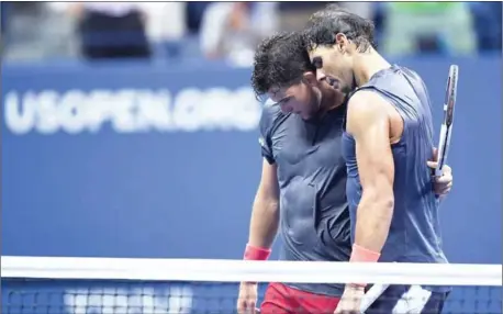  ?? AFP ?? Rafael Nadal embraces Dominic Thiem after beating him in their men’s singles quarterfin­al at the 2018 US Open at the USTA Billie Jean King National Tennis Center in New York on Wednesday.