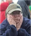  ?? PAUL KITAGAKI JR., THE SACRAMENTO BEE, VIA AP ?? Paula Gillock, 53, waits in line for breakfast at the Silver Dollar Fairground­s on Monday in Chico, Calif. She had to evacuate her home in Gridley and slept in her car with her cat Mimi.
