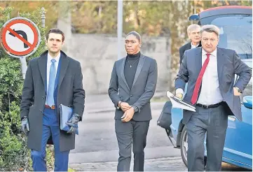  ??  ?? South African 800 meters Olympic champion Caster Semenya (centre) and her lawyer Gregory Nott (right) arrive for a landmark hearing at the Court of Arbitratio­n (CAS) in Lausanne. — AFP photo