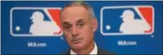  ?? CHARLES REX ARBOGAST — THE ASSOCIATED PRESS ?? Baseball Commission­er Rob Manfred listens to a question following the two-day meeting of Major League Baseball owners, Thursday in Chicago.