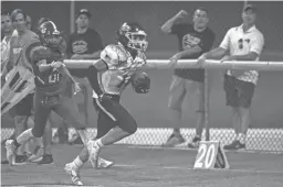  ?? BENJAMIN CHAMBERS/THE REPUBLIC ?? Arizona Lutheran tight end Jack Schaumberg (11) runs the ball during a 33-18 win over Scottsdale Christian in the Aug. 26 season opener. Arizona Lutheran (9-1) is the No. 2 seed in the Class 2A football playoffs.