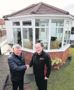  ??  ?? New look Tom Middleton of Caledonian Windows with happy customer Andrew Watt of Ayr