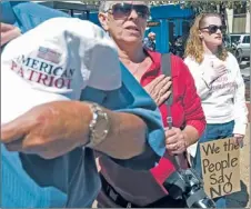  ??  ?? Gretchen Fritz (far right) attends the Republican rally Monday in Will County. | MATTHEW GROTTO~SUN-TIMES MEDIA