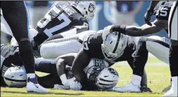  ?? Heidi Fang Las Vegas Review-Journal @HeidiFang ?? The Raiders and defensive end Mario Edwards — atop Tennessee’s DeMarco Murray, a Bishop Gorman product — were effective in the opener, allowing 95 yards rushing.