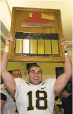  ?? Michael Pimentel / GoldenBear­Sports.com 2009 ?? Mike Mohamed holds up the Axe after his intercepti­on clinched Cal's 34-28 win over Stanford in 2009.