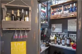  ??  ?? A hall closet turned into a wine bar was the couple’s first home project.