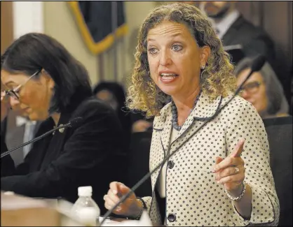  ?? Jacquelyn Martin The Associated Press ?? Rep. Debbie Wasserman Schultz, D-Fla., seen in May during a House Budget Committee hearing, fired IT staffer Imran Awan on July 25 after his arrest on a federal bank fraud charge. On July 24, federal authoritie­s arrested Awan at Dulles Internatio­nal...