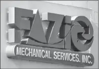  ?? The Associated Press ?? CONTRACTOR: A sign for Fazio Mechanical Services Inc. is at their location in Sharpsburg, Pa. on Friday. The western Pennsylvan­ia heating and refrigerat­ion contractor issued the statement late Thursday saying it was the victim of a " sophistica­ted...