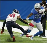  ?? PAUL SANCYA — THE ASSOCIATED PRESS ?? Detroit Lions running back Kerryon Johnson (33) runs out of bounds as Houston Texans strong safety Justin Reid (20) defends during the first half of Thursday’s game in Detroit.