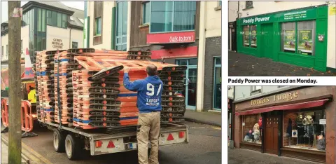  ??  ?? A man removing roadside barriers on St Michael’s Road, Gorey before the storm. Paddy Power was closed on Monday. Tomas Funge’s was closed on Monday.