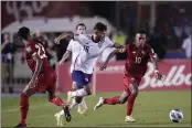  ?? ARNULFO FRANCO — THE ASSOCIATED PRESS ?? United States´ Ricardo Pepi, center, and Panama’s Edgar Barcenas battle for the ball during a qualifying match for the FIFA World Cup Qatar 2022 at Rommel Fernandez stadium, Panama city, Panama, Sunday.