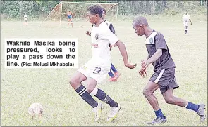  ?? (Pic: Melusi Mkhabela) ?? Wakhile Masika being pressured, looks to play a pass down the line.