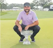  ?? AFP ?? Stephan Jaeger celebrates with the trophy after winning the Houston Open at Memorial Park Golf Course.