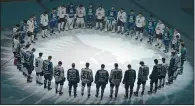  ?? STEVEN MAH/SOUTHWEST BOOSTER ?? The Swift Current Broncos and Moose Jaw Warriors came together to honour the Humboldt Broncos before their playoff game Sunday.