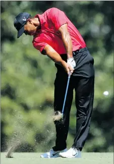  ?? — GETTY FILES ?? Tiger Woods, shown at the Masters April 8, says he’s improved his swing with better posture.