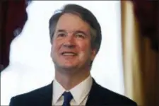  ?? EVAN VUCCI — THE ASSOCIATED PRESS FILE ?? In this file photo, Supreme Court nominee Brett Kavanaugh smiles during a meeting with Sen. Orrin Hatch, R-Utah, on Capitol Hill in Washington.