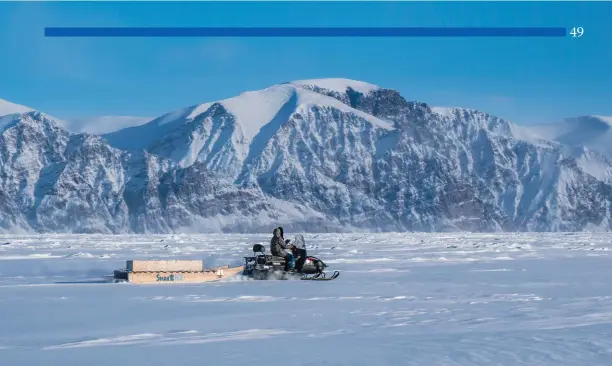  ?? Michael Schmidt photo ?? Moses Amagoalik, a SmartICE operator in Pond Inlet, measures sea-ice thickness in Eclipse Sound using the SmartQAMUT­IK (March 2018). SmartICE puts into the hands of communitie­s the tools they need to travel safely on changing sea ice.