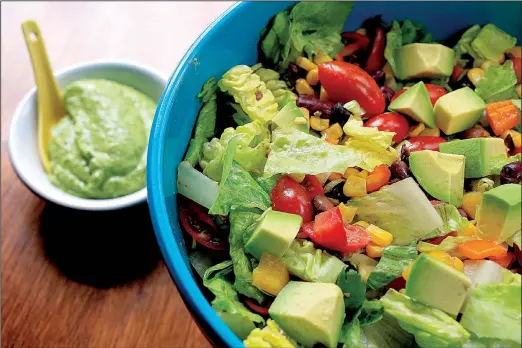  ?? Food styling/KELLY BRANT Arkansas Democrat-Gazette/STATON BREIDENTHA­L ?? Southweste­rn Chopped Salad includes lettuce, beans and fresh vegetables in a flavor-packed cilantro-lime-avocado dressing.