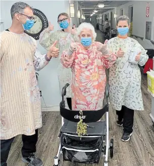  ?? COURTESY OF SHARON BEECROFT ?? Dorothy Bier, a resident of Anson Place, going for a walk on her 94th birthday after nearly two months of isolation.