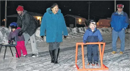  ?? SUBMITTED PHOTOS/ADAM GOULD ?? Grandparen­ts Delores and John Francis are shown with their grandson Chasin, a first-timer on skates. Edwin Christmas and his daughter Jenaya are shown in the background on the left.