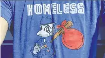  ??  ?? The “homeless Jays” shirts were not sanctioned by the baseball team, which has asked its players not to wear the garments in public.