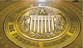  ?? ANDREW HARNIK AP ?? A Federal Reserve report Monday showed that banks raised their lending standards for business and consumer loans in the aftermath of bank failures.