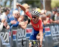  ?? JOHN COWPLAND/PHOTOSPORT ?? Tasman rider Jason Christie celebrates after winning the elite road national championsh­ips earlier this year.