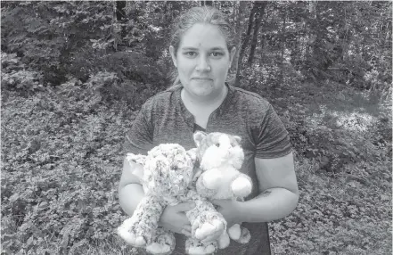  ?? Suzanne Rent ?? Alyssa Fitzmorris with two stuffed toys, an orange tabby cat and an elephant, that are just two of the hundreds she’s donated to children over the past four years. Fitzmorris started the Teddy Wishes Society to collect teddy bears to hand out to children in hospital. She created the society in honour of two friends.